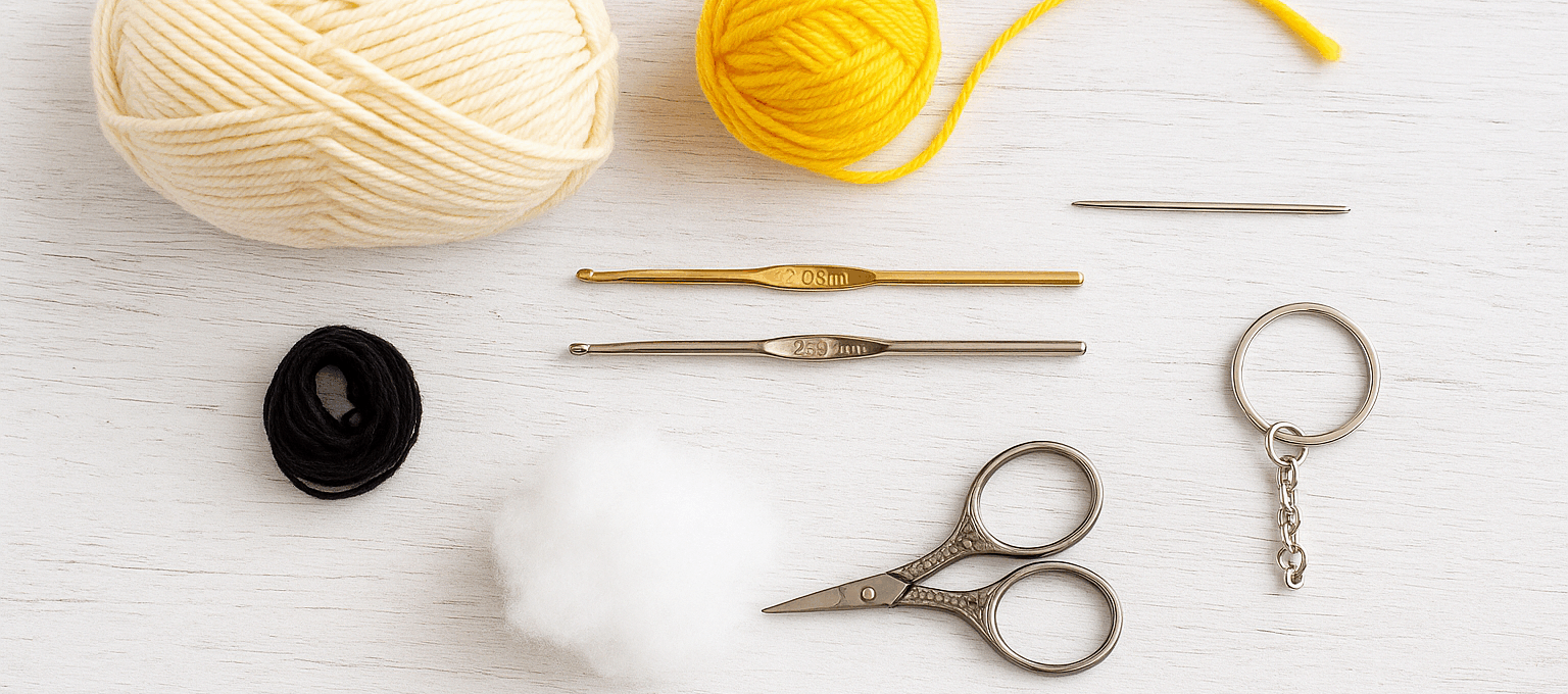 Crochet tools and yarn arranged for a handmade keychain project.