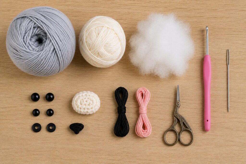 ⁠Crochet materials including yarn balls, crochet hooks, vintage scissors, and safety eyes on a wooden craft table.⁠
